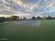 Outdoor tennis courts at Desert Breeze Park, lit by stadium lights for evening play at 4760 W Tulsa St, Chandler, AZ 85226