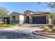 Single-story home with a two-car garage and landscaped front yard at 4765 S Pluto --, Mesa, AZ 85212