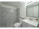 Updated bathroom with gray vanity and marble shower at 5115 N 22Nd Ave # 1, Phoenix, AZ 85015