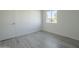 Simple bedroom with wood-look floors and window view at 5115 N 22Nd Ave # 1, Phoenix, AZ 85015