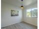 Simple bedroom with hardwood floors and large window at 5115 N 22Nd Ave # 1, Phoenix, AZ 85015