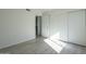 Bedroom with light flooring, closet, and door to hallway at 5115 N 22Nd Ave # 1, Phoenix, AZ 85015