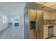 Kitchen features stainless steel refrigerator and fireplace view at 5115 N 22Nd Ave # 1, Phoenix, AZ 85015