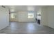 Spacious living area with gray laminate floors and a fireplace at 5115 N 22Nd Ave # 1, Phoenix, AZ 85015