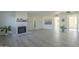 Bright living room featuring gray laminate floors and a fireplace at 5115 N 22Nd Ave # 1, Phoenix, AZ 85015