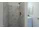 Clean shower with marble-look tile at 5115 N 22Nd Ave # 1, Phoenix, AZ 85015