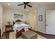 Bright bedroom with wooden bed frame and ceiling fan at 5133 N 34Th Pl, Phoenix, AZ 85018