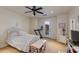 Bright bedroom with a queen-size bed and private balcony access at 5133 N 34Th Pl, Phoenix, AZ 85018