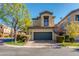 Two-story townhome with a two-car garage and well-manicured landscaping at 5133 N 34Th Pl, Phoenix, AZ 85018