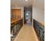 Upstairs hallway with wood railing and carpeted floor at 5133 N 34Th Pl, Phoenix, AZ 85018