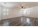 Spacious bedroom with wood floors and window shutters at 5172 E Desert Forest Trl, Cave Creek, AZ 85331