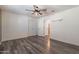 Bright bedroom with wood-look flooring and ceiling fan at 5172 E Desert Forest Trl, Cave Creek, AZ 85331