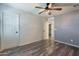 Bedroom with wood-look floors and ceiling fan at 5172 E Desert Forest Trl, Cave Creek, AZ 85331