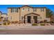 Two-story house with light brown exterior, stone accents, and a landscaped front yard at 5172 E Desert Forest Trl, Cave Creek, AZ 85331