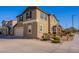 Two-story house with light brown exterior, stone accents, and a landscaped front yard at 5172 E Desert Forest Trl, Cave Creek, AZ 85331