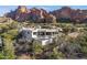 Stunning aerial view of a modern home with a pool and mountain backdrop at 5724 N Echo Canyon Dr, Phoenix, AZ 85018