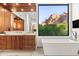 Beautiful bathroom featuring modern fixtures, a soaking tub and mountain view at 5724 N Echo Canyon Dr, Phoenix, AZ 85018