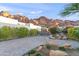 Paver driveway with desert landscaping leads to a modern home with mountain views at 5724 N Echo Canyon Dr, Phoenix, AZ 85018