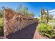 Stone entrance to Echo Canyon with desert landscaping and clear skies at 5724 N Echo Canyon Dr, Phoenix, AZ 85018