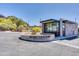 The entry gate to Echo Canyon features the community name with desert landscaping and mountain views in the background at 5724 N Echo Canyon Dr, Phoenix, AZ 85018