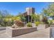 The community building's exterior features lush desert landscaping and a unique rock design at 5724 N Echo Canyon Dr, Phoenix, AZ 85018