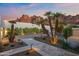 This property features gorgeous desert landscaping complemented by natural rock formations in the background at 5724 N Echo Canyon Dr, Phoenix, AZ 85018