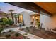 The exterior of this home features desert landscaping, pathway lighting, and unique desert flora and fauna at 5724 N Echo Canyon Dr, Phoenix, AZ 85018