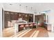 Bright kitchen featuring a waterfall island, modern appliances, wood cabinetry, and hardwood flooring at 5724 N Echo Canyon Dr, Phoenix, AZ 85018