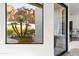 Interior view through a large window showcasing desert landscaping and mountain views at 5724 N Echo Canyon Dr, Phoenix, AZ 85018