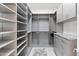 Spacious walk-in closet with custom shelving and storage at 5724 N Echo Canyon Dr, Phoenix, AZ 85018