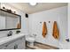 Modern bathroom with gray vanity, updated fixtures and wood-look tile floor at 6125 E Indian School Rd # 218, Scottsdale, AZ 85251