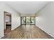 Living room with sliding glass doors leading to a balcony at 6125 E Indian School Rd # 218, Scottsdale, AZ 85251