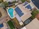 Top-down view of house showcasing solar panels and a kidney shaped pool at 629 E Palo Verde St, Casa Grande, AZ 85122