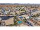 Aerial view of a house with solar panels and a pool in a residential neighborhood at 629 E Palo Verde St, Casa Grande, AZ 85122