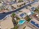 Aerial view showing a house with solar panels, pool, and surrounding homes at 629 E Palo Verde St, Casa Grande, AZ 85122