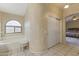 Bathroom features a bathtub, a sliding door, and a window at 629 E Palo Verde St, Casa Grande, AZ 85122