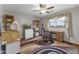 Bedroom with desk, chair, and ceiling fan at 629 E Palo Verde St, Casa Grande, AZ 85122