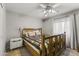 Spacious bedroom with wooden bed frame and ceiling fan at 629 E Palo Verde St, Casa Grande, AZ 85122