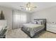 Bright bedroom with a gray bed and plenty of natural light at 629 E Palo Verde St, Casa Grande, AZ 85122