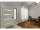 Bright dining room with hardwood floors and an adjacent entryway at 629 E Palo Verde St, Casa Grande, AZ 85122