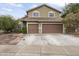 Two-story house with a two-car garage and landscaped front yard at 629 E Palo Verde St, Casa Grande, AZ 85122