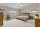 Large main bedroom with king-size bed and lots of natural light at 629 E Palo Verde St, Casa Grande, AZ 85122