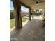 Covered patio with ceiling fan and view of the fenced backyard and swimming pool at 629 E Palo Verde St, Casa Grande, AZ 85122