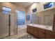 Elegant bathroom with double vanity, soaking tub and glass shower at 7073 E Brilliant Sky Dr, Scottsdale, AZ 85266