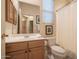 Clean bathroom with a shower/tub combo and wood vanity at 7073 E Brilliant Sky Dr, Scottsdale, AZ 85266