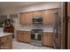 Modern kitchen with stainless steel appliances and light wood cabinets at 7073 E Brilliant Sky Dr, Scottsdale, AZ 85266