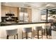 Modern kitchen with stainless steel appliances and breakfast bar at 7117 E Rancho Vista Dr # 1012, Scottsdale, AZ 85251