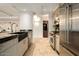 Modern kitchen with stainless steel appliances and farmhouse sink at 7117 E Rancho Vista Dr # 1012, Scottsdale, AZ 85251