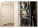 Convenient laundry room with stacked washer and dryer at 7117 E Rancho Vista Dr # 1012, Scottsdale, AZ 85251