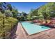 Community pool with lounge chairs and umbrellas at 7117 E Rancho Vista Dr # 1012, Scottsdale, AZ 85251